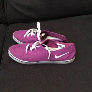 Purple Nike skate shoes
